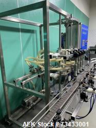 Complete Inline Bottle Filling and Packaging Line – Overflow Filler, Capper & Labeler